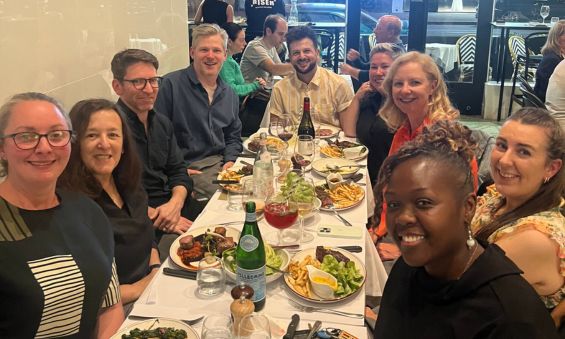 Helen Haines celebrating her years as chair with her fellow board members at a farewell dinner