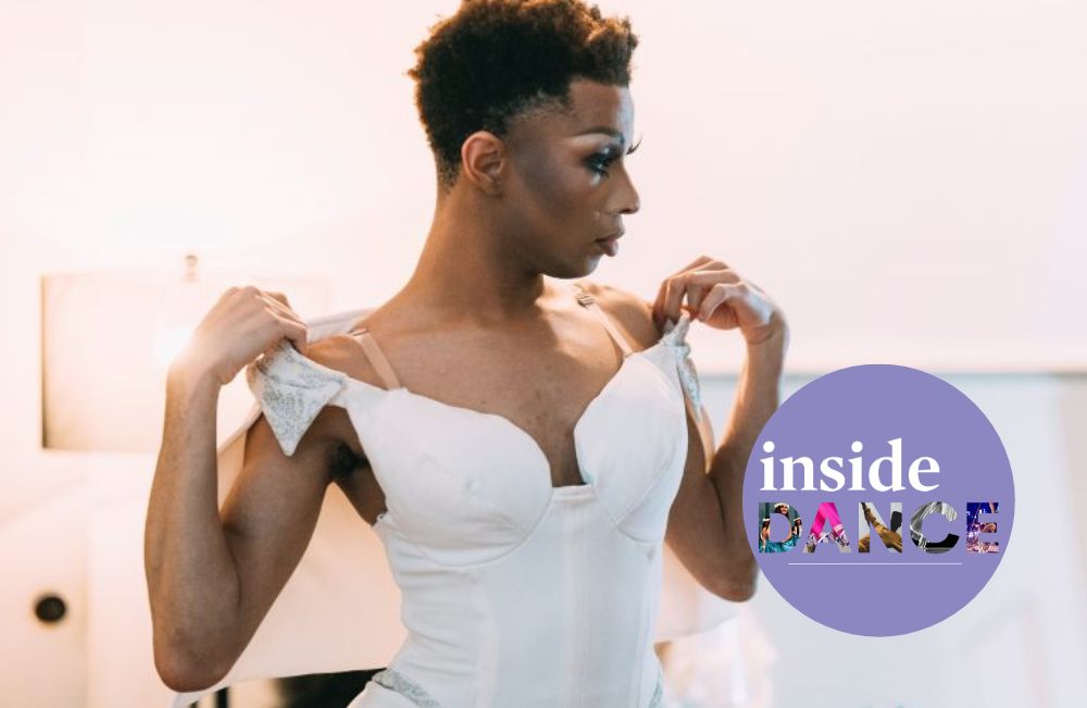 Creative Self Care. A person with short hair and stage-ready makeup looks to the right while adjusting the straps of a white tutu